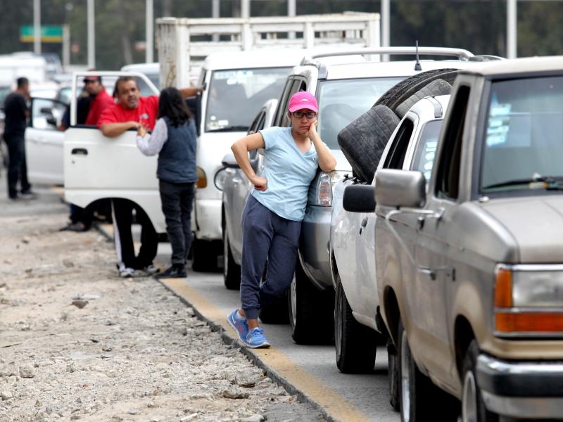 Motorists wait in line for hours to buy gasoline at a Pemex service station in Guadalajara, Mexico, on Sunday. The Mexican president temporarily closed some of the state oil company's pipelines, in a bid to wipe out rampant fuel theft. Motorists wait in line for hours to buy gasoline at a Pemex service station in Guadalajara, Mexico, on Sunday. The Mexican president temporarily closed some of the state oil company's pipelines, in a bid to wipe out rampant fuel theft.