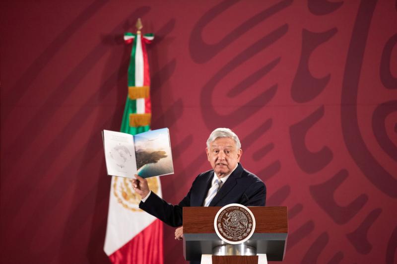 Mexican President Andrés Manuel López Obrador shows a brochure of the 787 Dreamliner belonging to the Mexican Presidency, during a news conference at the National Palace in Mexico City on Jan. 14. Mexican President Andrés Manuel López Obrador shows a brochure of the 787 Dreamliner belonging to the Mexican Presidency, during a news conference at the National Palace in Mexico City on Jan. 14.