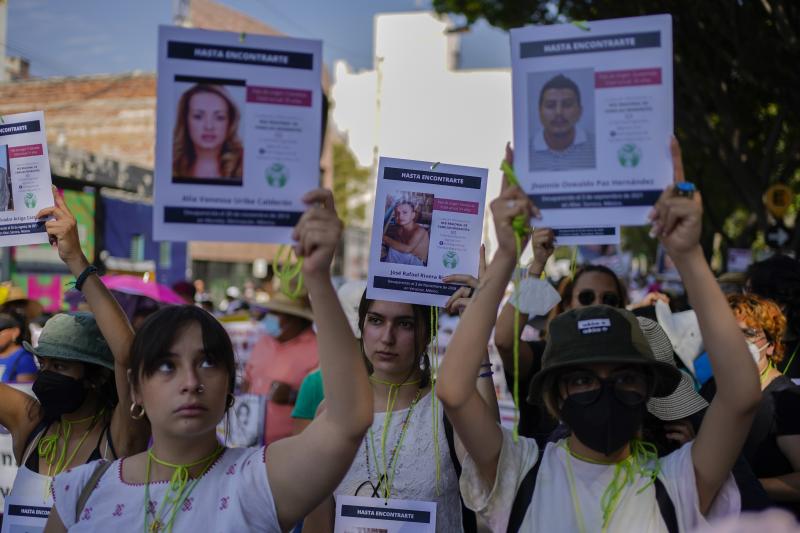 Protesters carry images of disappeared people on Mother's Day during an annual march by the mothers of missing people to demand the Mexican government step up efforts to locate the missing and prevent further disappearances, in Mexico City, May 10. Protesters carry images of disappeared people on Mother's Day during an annual march by the mothers of missing people to demand the Mexican government step up efforts to locate the missing and prevent further disappearances, in Mexico City, May 10.