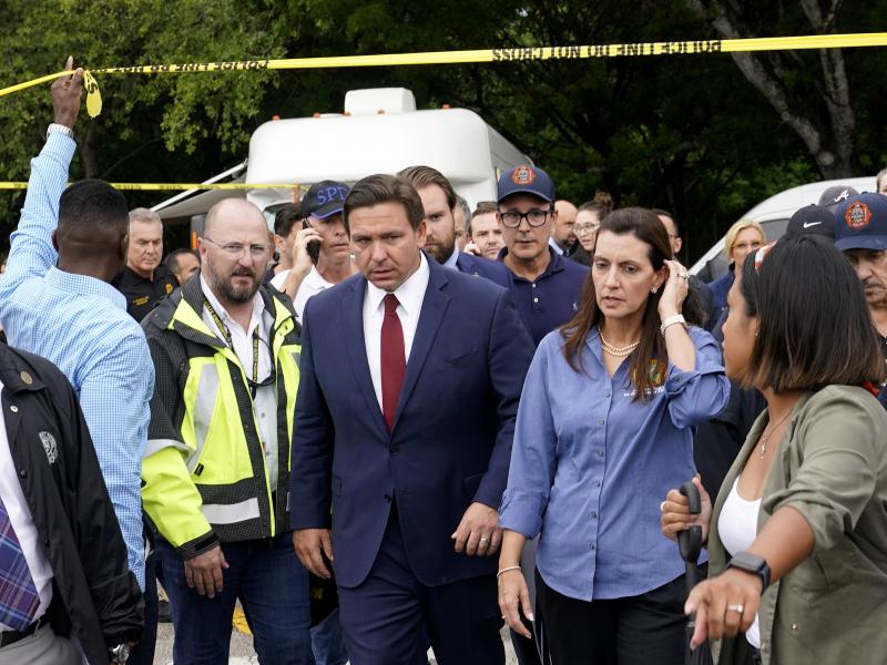 Florida Gov. Ron DeSantis (center) and Lt. Gov. Jeanette Nuñez (center right) arrive for a news conference near where a section of a 12-story beachfront condo building collapsed on Thursday in the town of Surfside. Florida Gov. Ron DeSantis (center) and Lt. Gov. Jeanette Nuñez (center right) arrive for a news conference near where a section of a 12-story beachfront condo building collapsed on Thursday in the town of Surfside.