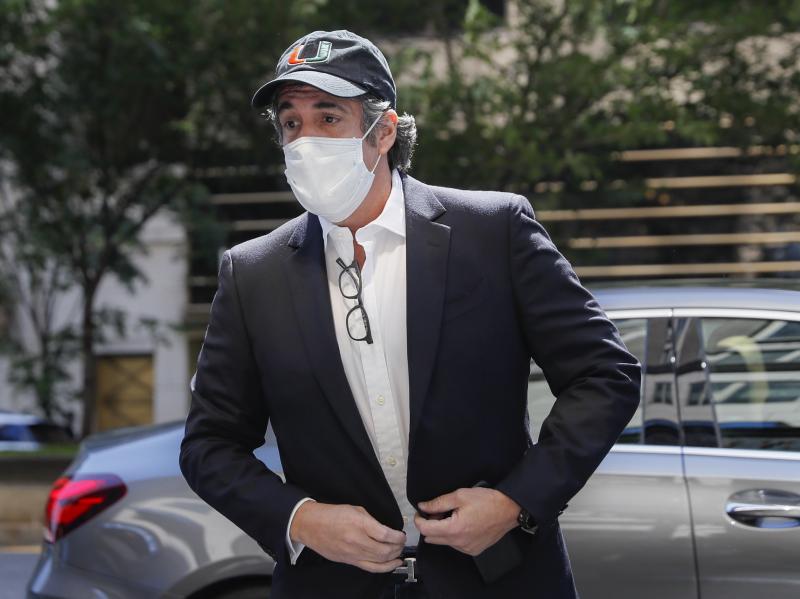 Michael Cohen arrives Thursday at his Manhattan apartment after being released from federal prison. Michael Cohen arrives Thursday at his Manhattan apartment after being released from federal prison.