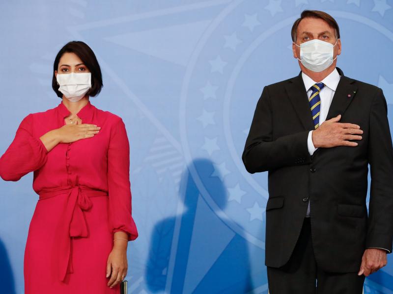 Michelle Bolsonaro tested positive on Thursday — days after her husband, Brazilian President Jair Bolsonaro, said he had recovered from the disease. The pair are seen here at an event on Wednesday. Michelle Bolsonaro tested positive on Thursday — days after her husband, Brazilian President Jair Bolsonaro, said he had recovered from the disease. The pair are seen here at an event on Wednesday.