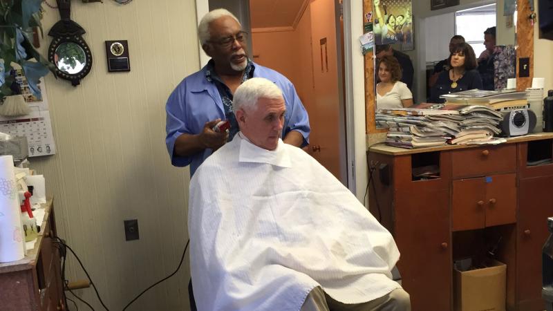 Indiana Gov. Mike Pence, the GOP vice presidential nominee, gets his hair trimmed by barber Henry Jones in Norristown, Pa. Indiana Gov. Mike Pence, the GOP vice presidential nominee, gets his hair trimmed by barber Henry Jones in Norristown, Pa.