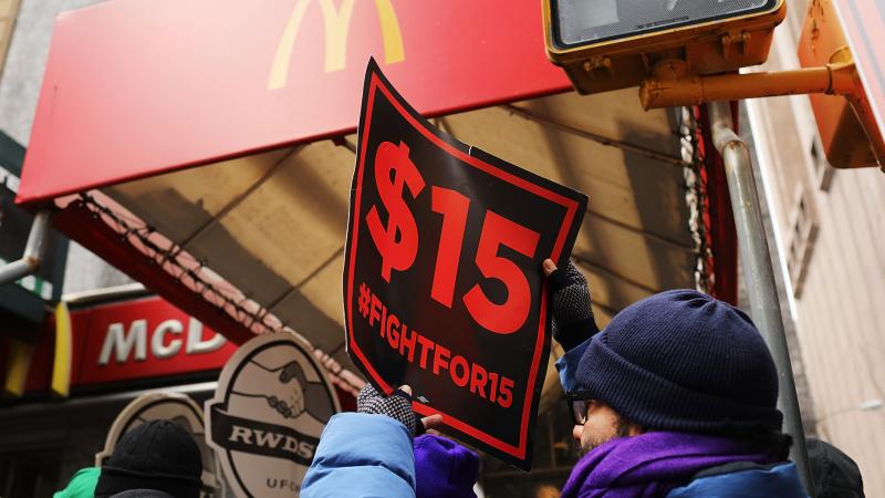 Protesters with NYC Fight for $15 gather in front of a McDonalds to rally against fast food executive Andrew Puzder, who was President Trump's nominee to lead the Labor Department on February 13, 2017 in New York City. Protesters with NYC Fight for $15 gather in front of a McDonalds to rally against fast food executive Andrew Puzder, who was President Trump's nominee to lead the Labor Department on February 13, 2017 in New York City.