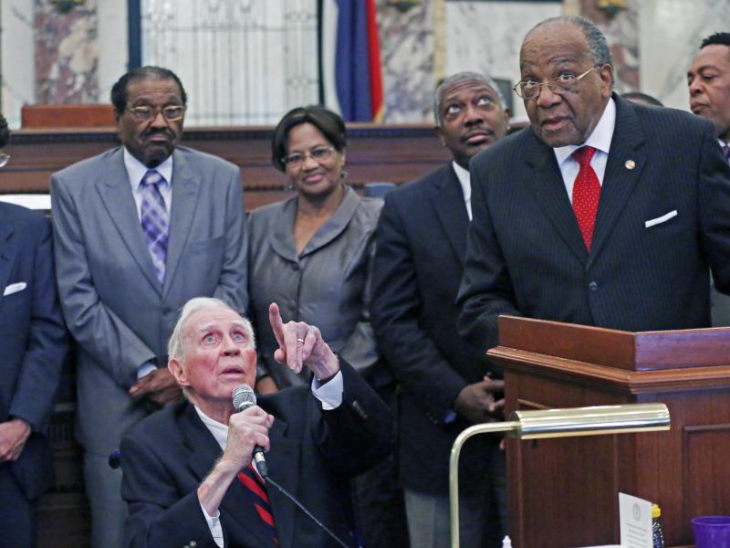 Veteran Mississippi journalist Bill Minor (seated) points out a ceiling inscription to state Sen. David Jordan, D-Greenwood, at the lectern) in Mississippi Senate chambers in 2015. Minor, who died on Tuesday, was being honored in the 2015 ceremony with a Veteran Mississippi journalist Bill Minor (seated) points out a ceiling inscription to state Sen. David Jordan, D-Greenwood, at the lectern) in Mississippi Senate chambers in 2015. Minor, who died on Tuesday, was being honored in the 2015 ceremony with a
