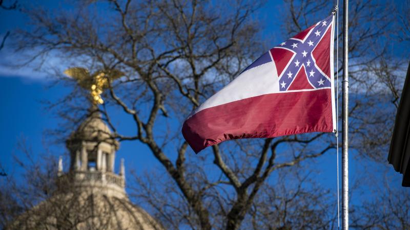 The flag of the state of Mississippi flies in front of the Mississippi State Capitol dome on Jan. 10, 2019. Lawmakers have cleared the way for legislation to remove and replace the flag. The flag of the state of Mississippi flies in front of the Mississippi State Capitol dome on Jan. 10, 2019. Lawmakers have cleared the way for legislation to remove and replace the flag.