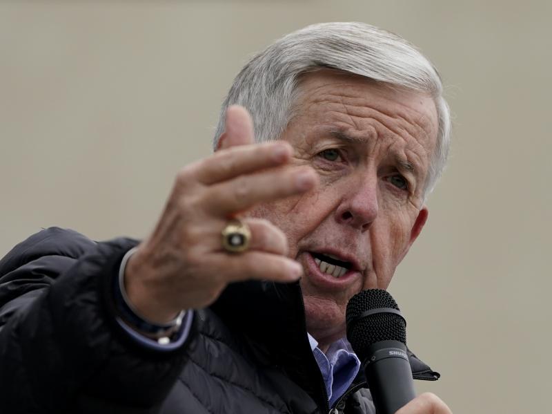 Missouri Gov. Mike Parson speaks at a campaign rally at a gun store in October in Lee's Summit, Mo. Parson has signed into law a measure that could fine state and local law enforcement officers $50,000 for helping to enforce federal gun laws. Missouri Gov. Mike Parson speaks at a campaign rally at a gun store in October in Lee's Summit, Mo. Parson has signed into law a measure that could fine state and local law enforcement officers $50,000 for helping to enforce federal gun laws.