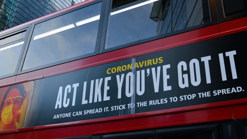 Moderna will test new COVID-19 vaccine booster doses, saying that while its vaccine should protect against variants found in the U.K. and South Africa, it isn't as effective against the South African strain. Here, a bus in London carries a sign telling pe Moderna will test new COVID-19 vaccine booster doses, saying that while its vaccine should protect against variants found in the U.K. and South Africa, it isn't as effective against the South African strain. Here, a bus in London carries a sign telling pe