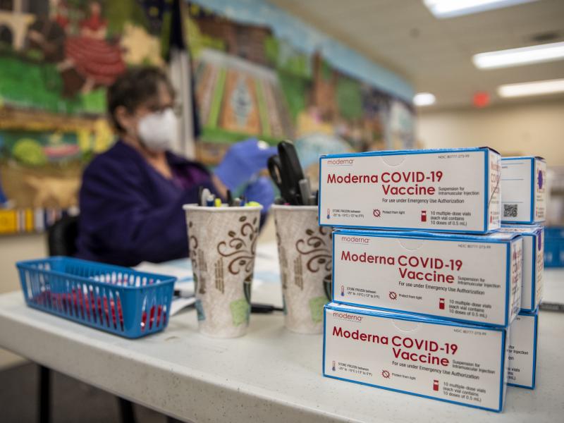 A nurse prepares a dose of the Moderna COVID-19 vaccine at a San Antonio senior center in March. A panel of advisers to the Food and Drug Administration will meet Thursday to review Moderna's booster shot. A nurse prepares a dose of the Moderna COVID-19 vaccine at a San Antonio senior center in March. A panel of advisers to the Food and Drug Administration will meet Thursday to review Moderna's booster shot.