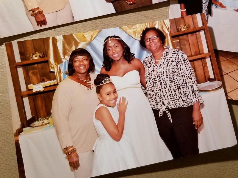 Brittney Mills (center) stands with her mother, Barbara (left), daughter, Kamille, and a family friend at her baby shower days before Brittney was killed. Brittney Mills (center) stands with her mother, Barbara (left), daughter, Kamille, and a family friend at her baby shower days before Brittney was killed.