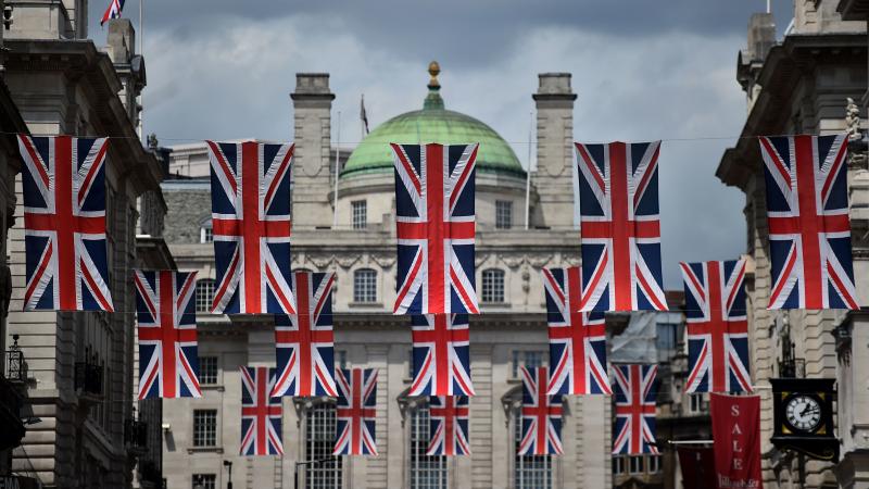 Union flags fly as banners across a street in central London on Tuesday. EU leaders attempted to rescue the European project and Prime Minister David Cameron sought to calm fears over the U.K.'s vote to leave the bloc as ratings agencies downgraded the co Union flags fly as banners across a street in central London on Tuesday. EU leaders attempted to rescue the European project and Prime Minister David Cameron sought to calm fears over the U.K.'s vote to leave the bloc as ratings agencies downgraded the co