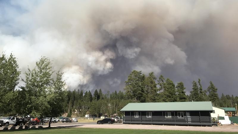 Smoke plumes rise from the Rice Ridge Fire in August, behind Montana's Seeley Lake Elementary School, in Seeley Lake, Mont. Smoke plumes rise from the Rice Ridge Fire in August, behind Montana's Seeley Lake Elementary School, in Seeley Lake, Mont.