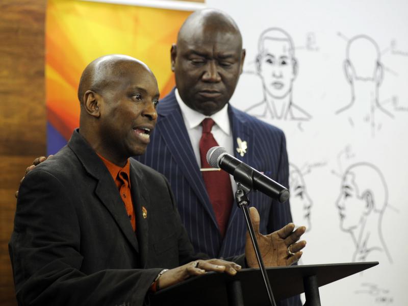 Flanked by attorney Ben Crump, Emantic Bradford Sr. discusses the results of a forensic examination on his son Emantic "EJ" Bradford Jr., who was fatally shot by police after a shooting in a shopping mall on Thanksgiving Day, after being mistaken for a su Flanked by attorney Ben Crump, Emantic Bradford Sr. discusses the results of a forensic examination on his son Emantic "EJ" Bradford Jr., who was fatally shot by police after a shooting in a shopping mall on Thanksgiving Day, after being mistaken for a su