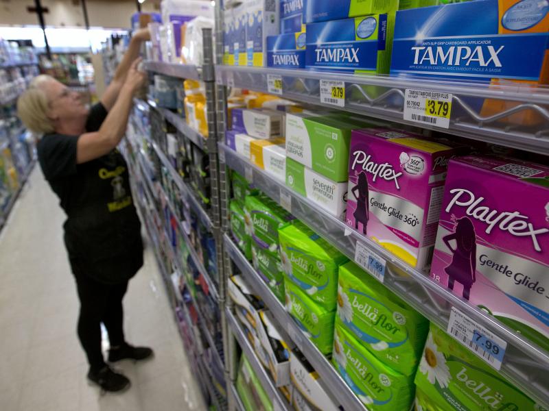Tammy Compton restocks tampons at Compton's Market, in Sacramento, Calif., on June 22, 2016. Tammy Compton restocks tampons at Compton's Market, in Sacramento, Calif., on June 22, 2016.