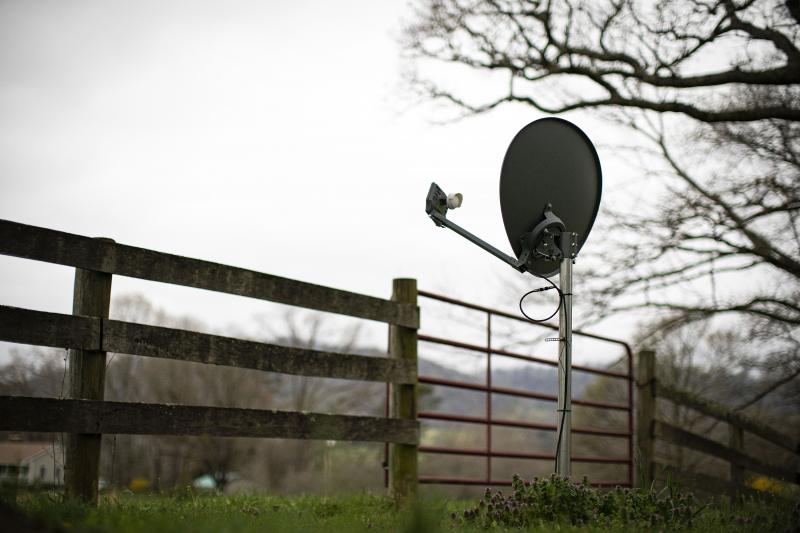 A Viasat internet satellite dish is seen in the yard of a house in Madison, Va., on March 31. A Viasat internet satellite dish is seen in the yard of a house in Madison, Va., on March 31.