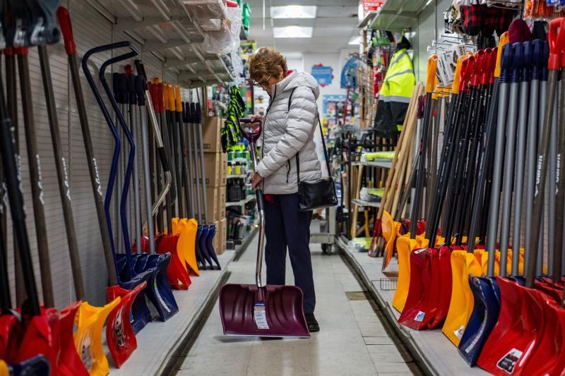 A woman inspects a snow shovel at Woodside Ace Hardware in Winthrop, Mass., on Friday as people prepare for the oncoming nor'easter. The storm is expected to bring blizzard conditions and 18-24 inches of snow to the region as well as some flooding. A woman inspects a snow shovel at Woodside Ace Hardware in Winthrop, Mass., on Friday as people prepare for the oncoming nor'easter. The storm is expected to bring blizzard conditions and 18-24 inches of snow to the region as well as some flooding.