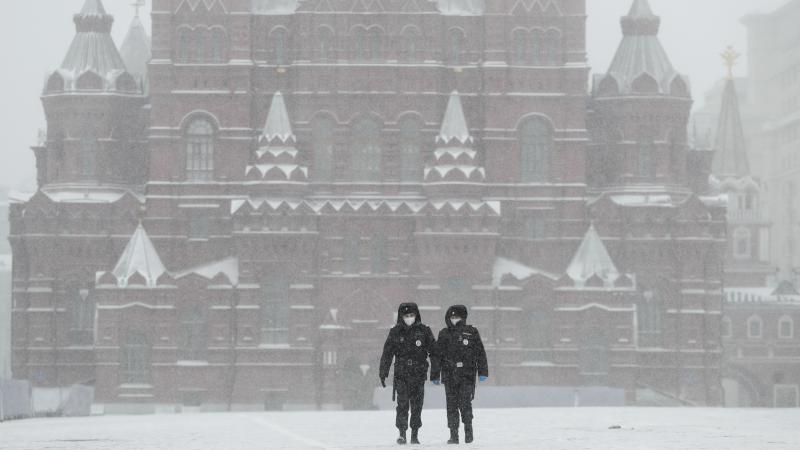 Police officers walk across an empty Red Square in Moscow on Tuesday, as the Russian capital goes into lockdown to stem the spread of the new coronavirus. Police officers walk across an empty Red Square in Moscow on Tuesday, as the Russian capital goes into lockdown to stem the spread of the new coronavirus.