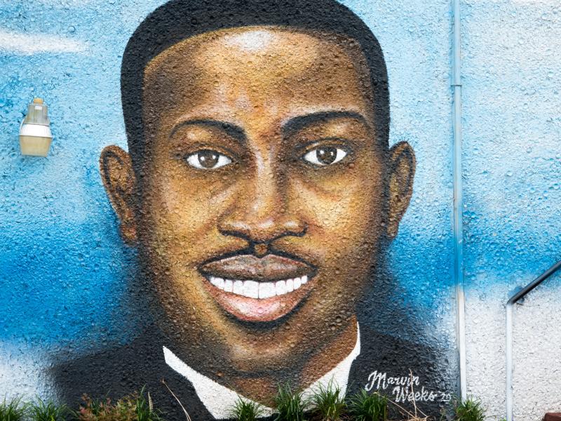 A mural depicting Ahmaud Arbery in July 2020 in Brunswick, Ga. Gregory McMichael, Travis McMichael and William "Roddie" Bryan are facing murder charges in connection with his death. A mural depicting Ahmaud Arbery in July 2020 in Brunswick, Ga. Gregory McMichael, Travis McMichael and William "Roddie" Bryan are facing murder charges in connection with his death.