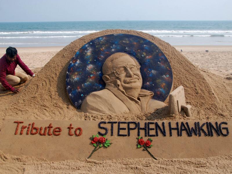 Sand artist Sudarsan Pattnaik puts final touches on a sculpture in honor of Stephen Hawking at Puri Beach near Bhubaneswar, India, on Wednesday. Sand artist Sudarsan Pattnaik puts final touches on a sculpture in honor of Stephen Hawking at Puri Beach near Bhubaneswar, India, on Wednesday.