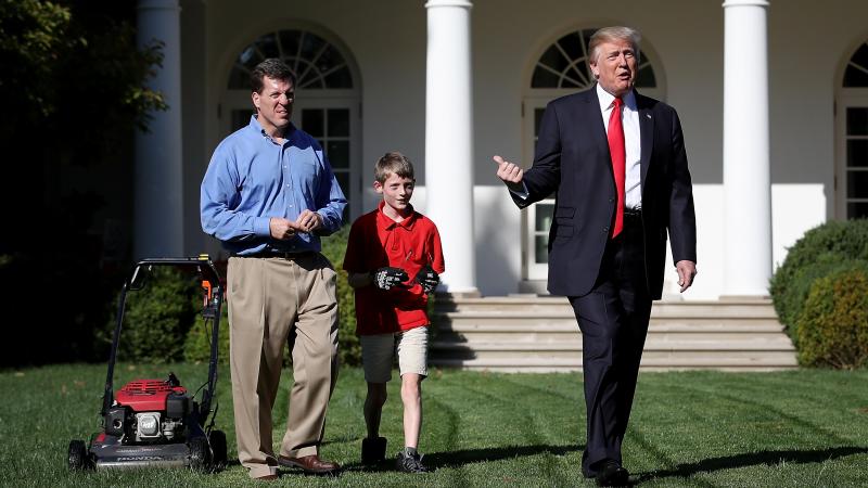 Eleven-year-old Frank "FX" Giaccio walks with President Donald Trump while mowing the grass in the Rose Garden of the White House on Friday. Also pictured is Frank's father, Greg Giaccio. Eleven-year-old Frank "FX" Giaccio walks with President Donald Trump while mowing the grass in the Rose Garden of the White House on Friday. Also pictured is Frank's father, Greg Giaccio.