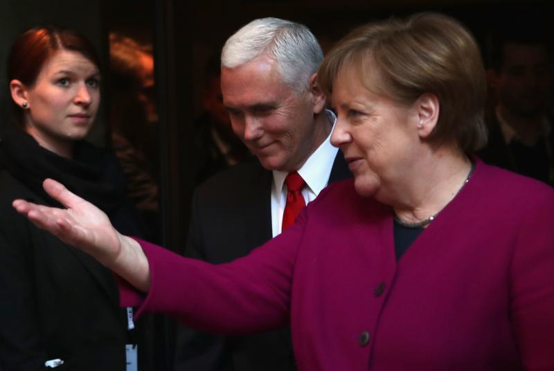 German Chancellor Angela Merkel and U.S. Vice President Pence talk at the Munich Security Conference on Saturday. German Chancellor Angela Merkel and U.S. Vice President Pence talk at the Munich Security Conference on Saturday.