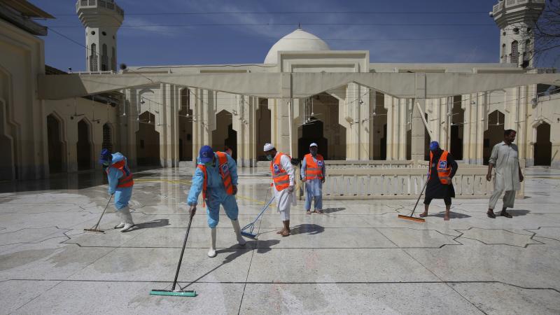 Volunteers disinfect a mosque ahead of prayers during the Muslim holy month of Ramadan in Peshawar, Pakistan, on Friday. Volunteers disinfect a mosque ahead of prayers during the Muslim holy month of Ramadan in Peshawar, Pakistan, on Friday.