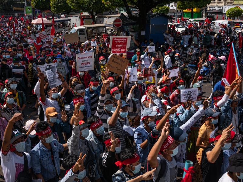 Protesters hold placards and shout slogans on Saturday in Yangon, Myanmar. Myanmar declared martial law in parts of the country, including its two largest cities, as protests continued to draw people to the streets after the military staged a coup. Protesters hold placards and shout slogans on Saturday in Yangon, Myanmar. Myanmar declared martial law in parts of the country, including its two largest cities, as protests continued to draw people to the streets after the military staged a coup.