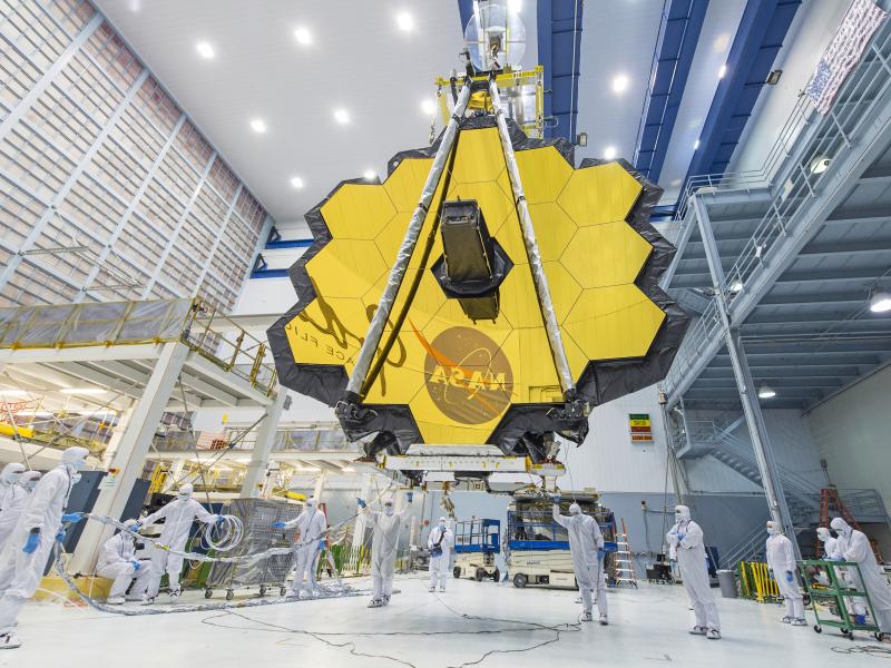 In 2017, technicians lift the mirror assembly of the James Webb Space Telescope using a crane inside a clean room at NASA's Goddard Space Flight Center in Greenbelt, Md. In 2017, technicians lift the mirror assembly of the James Webb Space Telescope using a crane inside a clean room at NASA's Goddard Space Flight Center in Greenbelt, Md.