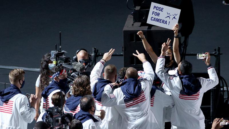 Members of the U.S. team pose for NBC cameras during the closing ceremony on Sunday. Members of the U.S. team pose for NBC cameras during the closing ceremony on Sunday.