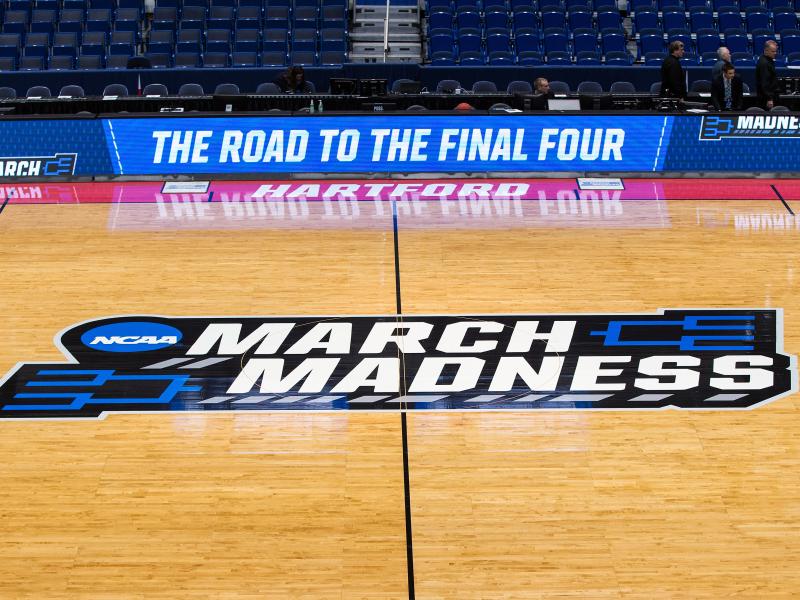 A view of the NCAA logo during the first round of March Madness on March 21, 2019, at XL Center in Hartford, Conn. The NCAA announced it plans to hold the 2021 Men's Division I tournament in a single geographic location. A view of the NCAA logo during the first round of March Madness on March 21, 2019, at XL Center in Hartford, Conn. The NCAA announced it plans to hold the 2021 Men's Division I tournament in a single geographic location.