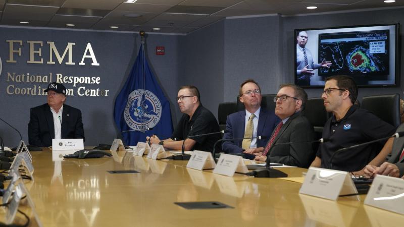 Acting NOAA head Neil Jacobs, seen here at far right as President Trump watches a briefing on Hurricane Dorian, is defending his agency's response to Trump's claim that Dorian had been predicted to hit Alabama hard. Acting NOAA head Neil Jacobs, seen here at far right as President Trump watches a briefing on Hurricane Dorian, is defending his agency's response to Trump's claim that Dorian had been predicted to hit Alabama hard.