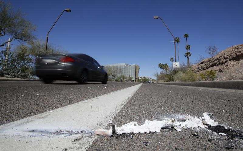 A vehicle drives by the spot where an Uber self-driving vehicle struck and killed a pedestrian earlier this year in Tempe, Ariz. The National Transportation Safety Board released a preliminary report Thursday on the collision. A vehicle drives by the spot where an Uber self-driving vehicle struck and killed a pedestrian earlier this year in Tempe, Ariz. The National Transportation Safety Board released a preliminary report Thursday on the collision.