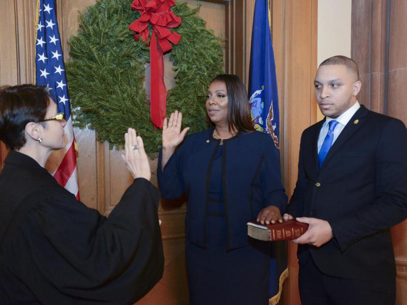 Letitia James (center) is sworn in as New York's 67th Attorney General in a ceremony Monday night at the state capitol in Albany. James is the state's first black attorney general, as well as the first woman to hold the state-wide elected office. Letitia James (center) is sworn in as New York's 67th Attorney General in a ceremony Monday night at the state capitol in Albany. James is the state's first black attorney general, as well as the first woman to hold the state-wide elected office.