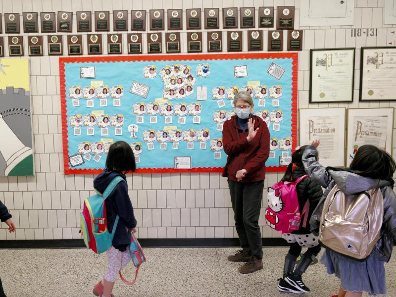 Students wave goodbye during dismissal at Yung Wing School P.S. 124 on March 25, 2021 in New York City. Students wave goodbye during dismissal at Yung Wing School P.S. 124 on March 25, 2021 in New York City.