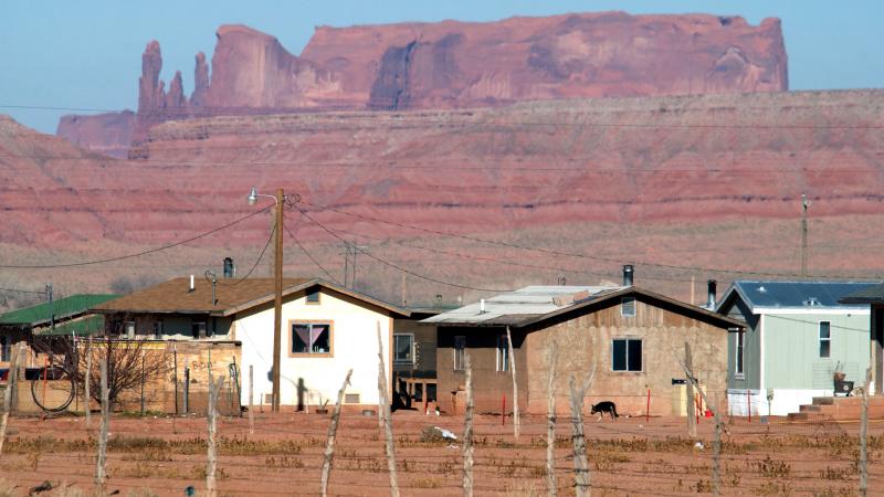 Houses on the Navajo Nation sit near sandstone cliffs north of Many Farms, Ariz. New Census Bureau estimates show a low rate of high-speed internet access among Native Americans who live on tribal land. Houses on the Navajo Nation sit near sandstone cliffs north of Many Farms, Ariz. New Census Bureau estimates show a low rate of high-speed internet access among Native Americans who live on tribal land.