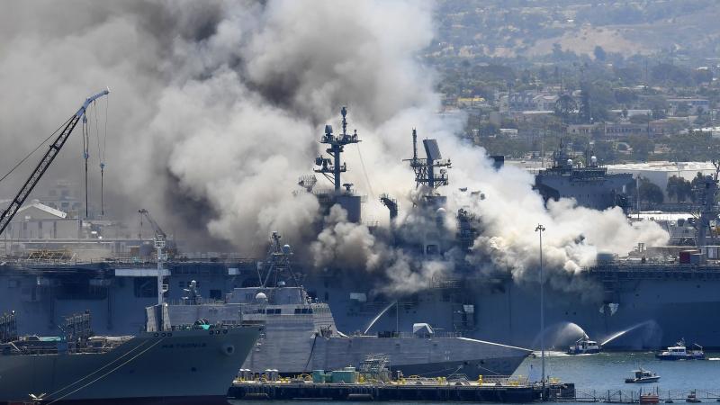 Smoke rises from the USS Bonhomme Richard after an explosion and fire on board the amphibious assault ship at Naval Base San Diego. The Navy is investigating whether the fire was due to arson. Smoke rises from the USS Bonhomme Richard after an explosion and fire on board the amphibious assault ship at Naval Base San Diego. The Navy is investigating whether the fire was due to arson.