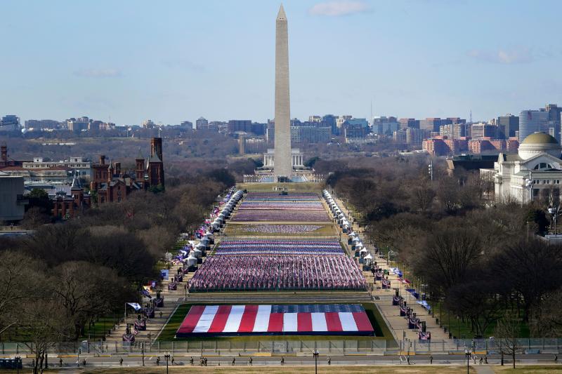 Nearly 200,000 flags on the National Mall represent the thousands of people who cannot attend the inauguration because of the pandemic and tight security in the nation's capital. Nearly 200,000 flags on the National Mall represent the thousands of people who cannot attend the inauguration because of the pandemic and tight security in the nation's capital.