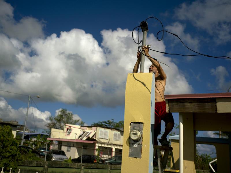 In October 2017, a resident tries to connect electrical lines downed by Hurricane Maria in Toa Baja. Puerto Rican officials say electricity has returned to all residents without it after the hurricane. In October 2017, a resident tries to connect electrical lines downed by Hurricane Maria in Toa Baja. Puerto Rican officials say electricity has returned to all residents without it after the hurricane.