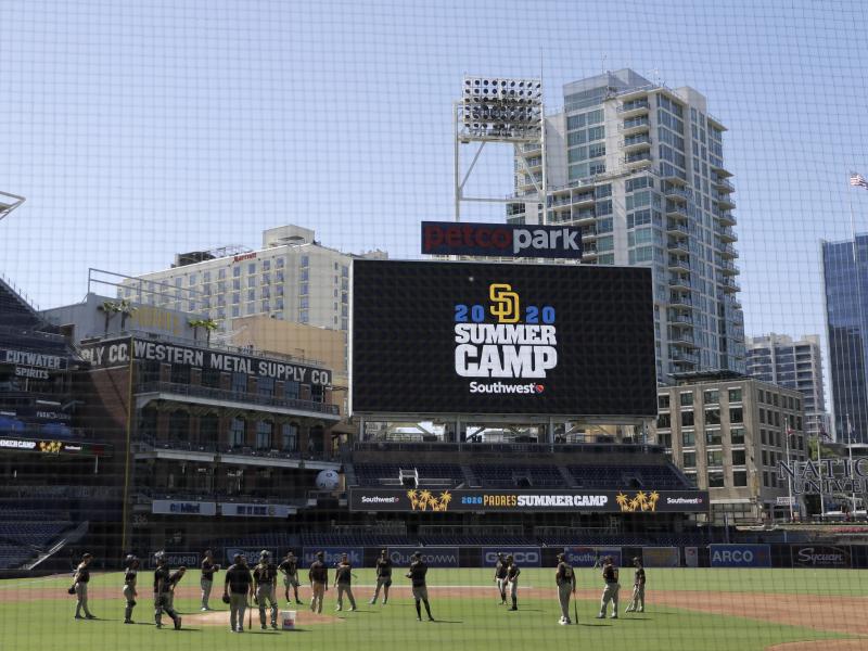 Members of the San Diego Padres meet in the infield during baseball training last week at Petco Park in San Diego. Major League Baseball is taking steps to start the 2020 season amid the coronavirus pandemic. Members of the San Diego Padres meet in the infield during baseball training last week at Petco Park in San Diego. Major League Baseball is taking steps to start the 2020 season amid the coronavirus pandemic.