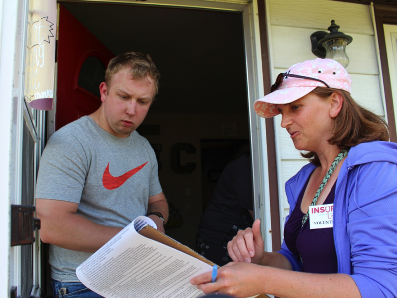 Nebraska resident Nick Carpenter listens as Becky Gould explains the Medicaid expansion petition in early July. Nebraska resident Nick Carpenter listens as Becky Gould explains the Medicaid expansion petition in early July.