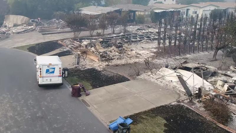 Aerial drone footage shows a U.S. Postal Service mail carrier making the rounds in Santa Rosa, Calif., delivering mail at houses that were reduced to rubble by intense wildfires. Aerial drone footage shows a U.S. Postal Service mail carrier making the rounds in Santa Rosa, Calif., delivering mail at houses that were reduced to rubble by intense wildfires.