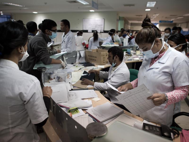 Hospital staff members work at the reception area of a hospital in Kathmandu. Some 14,000 were injured in Nepal's earthquake. Hospital staff members work at the reception area of a hospital in Kathmandu. Some 14,000 were injured in Nepal's earthquake.