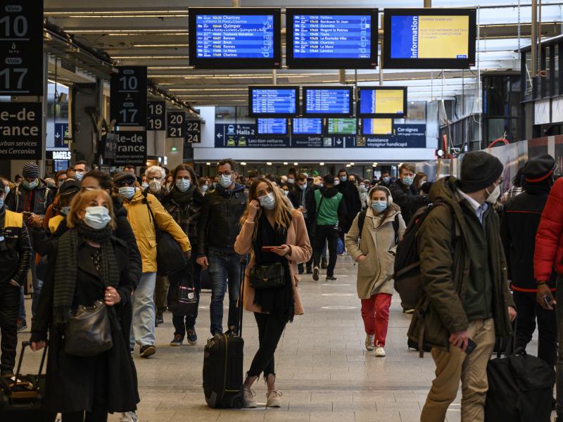 Travelers waited to flee Paris at the Montparnasse Train Station on Friday ahead of a new lockdown announced by the government in response to a surge in cases of the coronavirus. Travelers waited to flee Paris at the Montparnasse Train Station on Friday ahead of a new lockdown announced by the government in response to a surge in cases of the coronavirus.