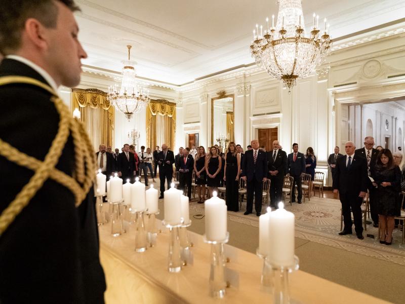 President Donald Trump and First Lady Melania Trump join guests in singing "America the Beautiful" during a reception in honor of Gold Star Families on Sept. 27, in the East Room of the White House. President Donald Trump and First Lady Melania Trump join guests in singing "America the Beautiful" during a reception in honor of Gold Star Families on Sept. 27, in the East Room of the White House.