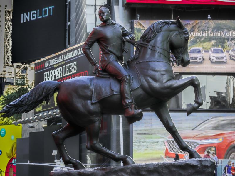 Kehinde Wiley's statue Rumors of War spent several weeks at New York's Times Square in late September. The work was unveiled Tuesday in Richmond as a permanent installation. Kehinde Wiley's statue Rumors of War spent several weeks at New York's Times Square in late September. The work was unveiled Tuesday in Richmond as a permanent installation.