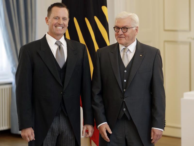 U.S. Ambassador to Germany Richard Grenell (left) and German President Frank-Walter Steinmeier greet the media during Grenell's accreditation process at the Bellevue Palace in Berlin on Tuesday. U.S. Ambassador to Germany Richard Grenell (left) and German President Frank-Walter Steinmeier greet the media during Grenell's accreditation process at the Bellevue Palace in Berlin on Tuesday.