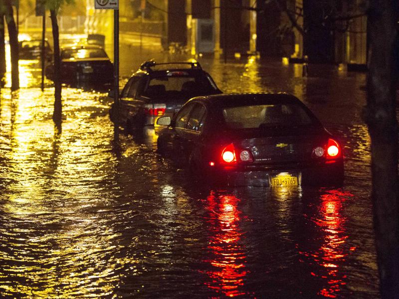 Vehicles sit in high floodwater during a storm surge associated with Superstorm Sandy in 2012, near the Brooklyn-Battery Tunnel in New York. Vehicles sit in high floodwater during a storm surge associated with Superstorm Sandy in 2012, near the Brooklyn-Battery Tunnel in New York.