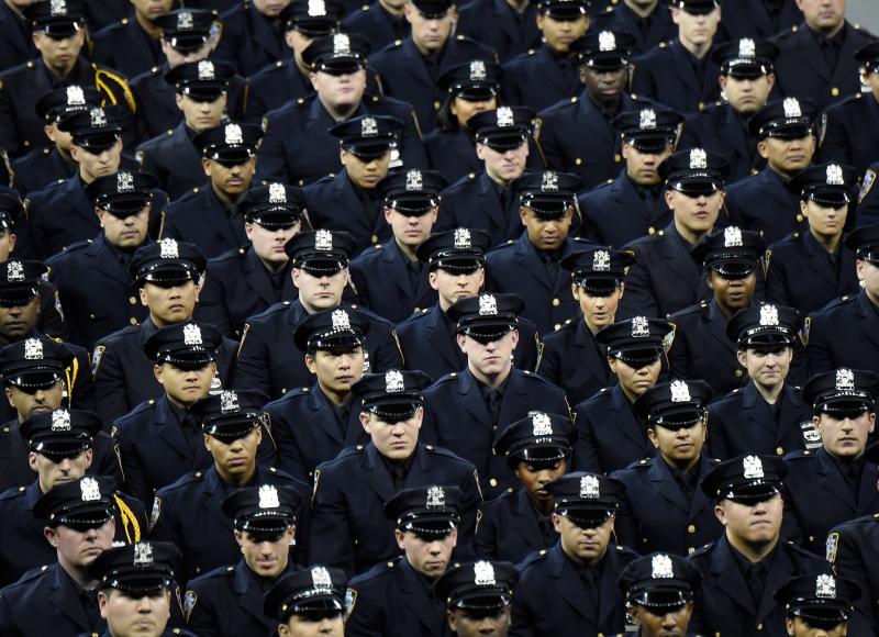 Cadets stand during the New York Police Department graduation ceremony at Madison Square Garden on Monday. Cadets stand during the New York Police Department graduation ceremony at Madison Square Garden on Monday.