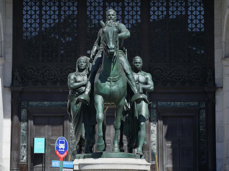 The Theodore Roosevelt Equestrian Statue is shown in front of the American Museum of Natural History's Central Park West entrance in New York City in 2020. Removal began this week. The Theodore Roosevelt Equestrian Statue is shown in front of the American Museum of Natural History's Central Park West entrance in New York City in 2020. Removal began this week.