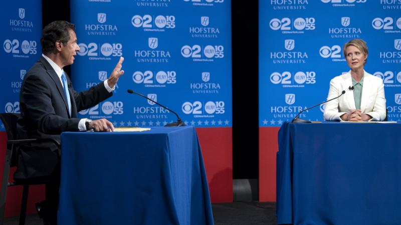 New York Gov. Andrew Cuomo answers a question as Democratic New York gubernatorial candidate Cynthia Nixon looks on during a gubernatorial debate at Hofstra University last month. New York Gov. Andrew Cuomo answers a question as Democratic New York gubernatorial candidate Cynthia Nixon looks on during a gubernatorial debate at Hofstra University last month.